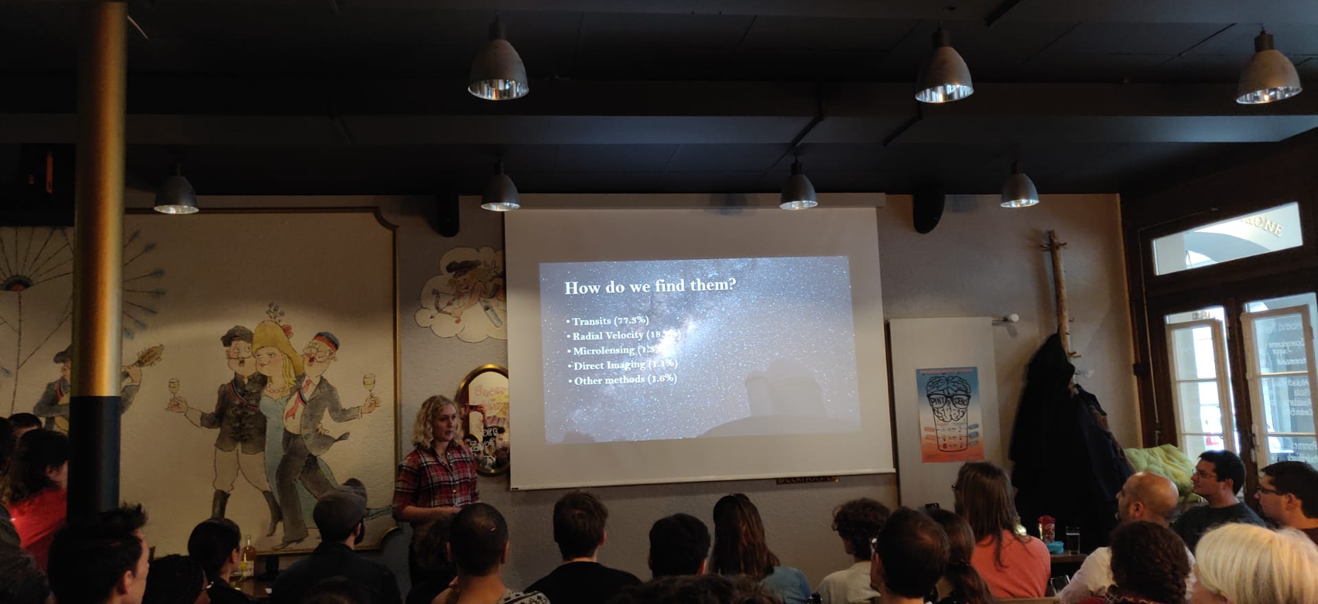 Chloe giving an outreach talk at Pint of Science Bern 2019